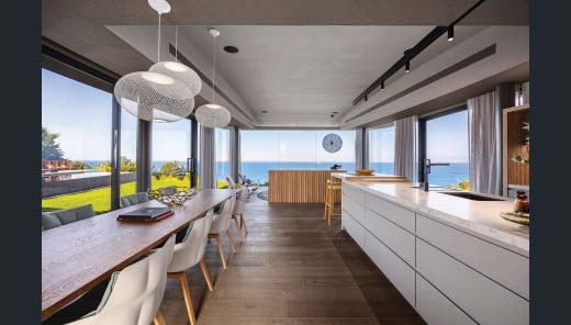 Long kitchen with coastal outlook