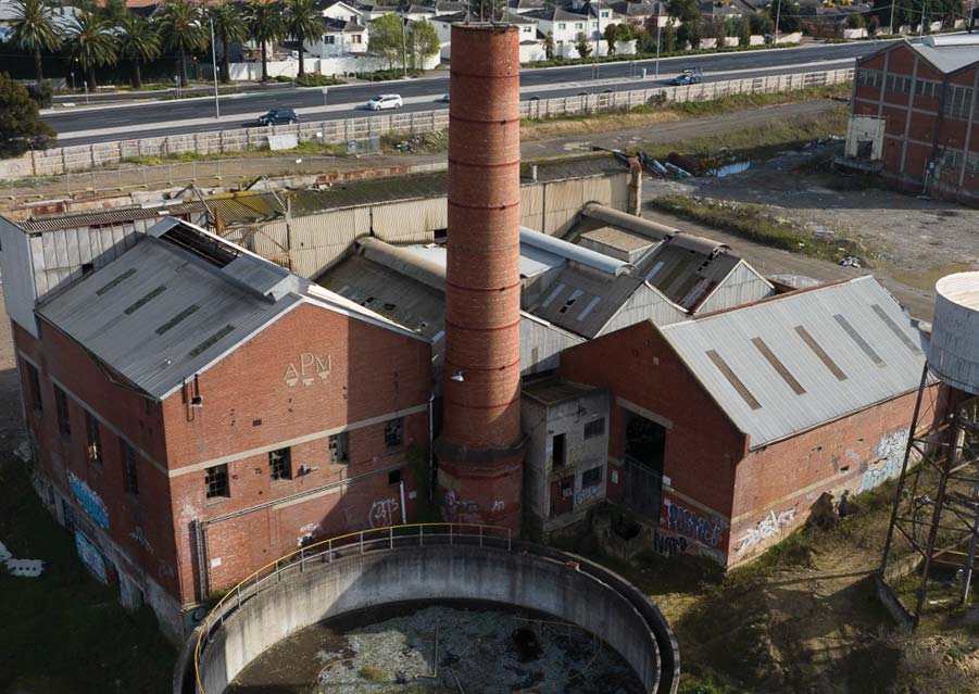 Historic brick boiler house and chimney at the former Alphington paper mill
